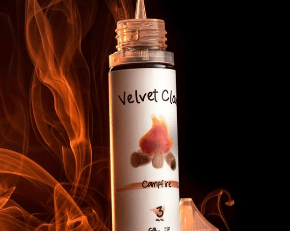 Velvet Cloud campfire dessert e-liquid flavor with flames in the background