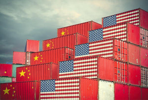 shipping containers with Chinese and American flags to symbolize tariffs