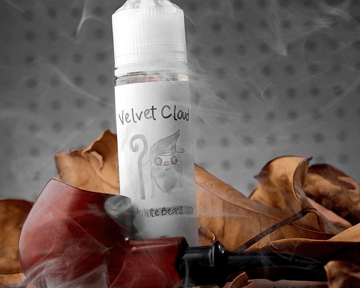 Velvet Cloud White Beard tobacco-flavored e-liquid with a tobacco pipe in the foreground