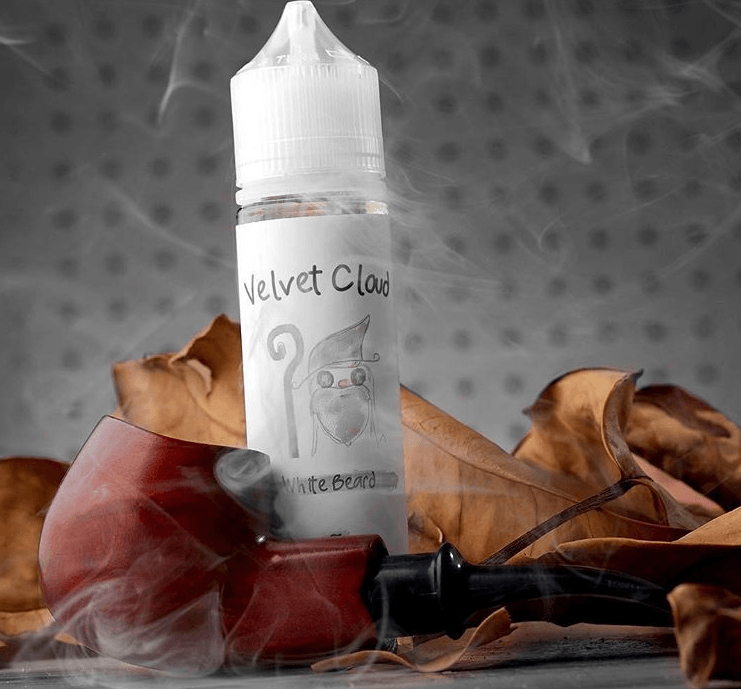 Velvet Cloud White Beard tobacco-flavored e-liquid with a tobacco pipe in the foreground