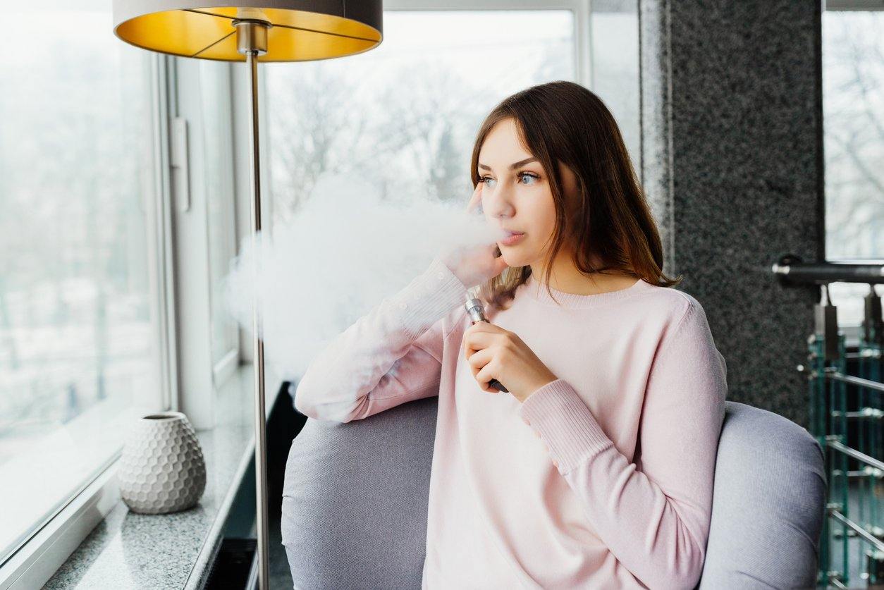 young woman vaping