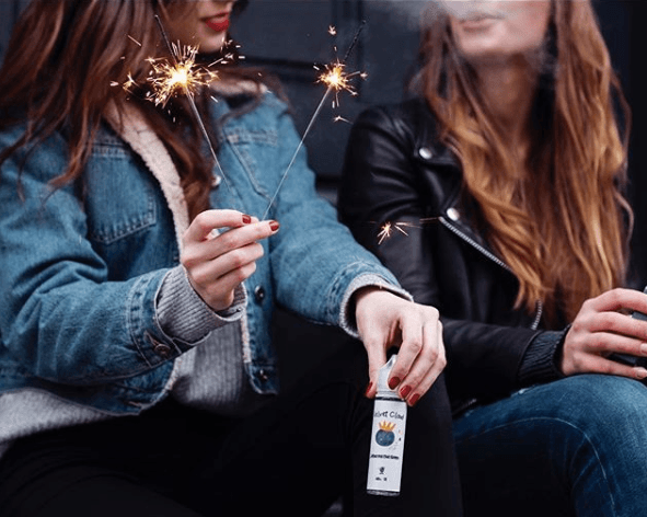 two women vaping at party